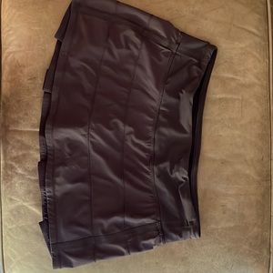 Black Lululemon tennis skirt with built in shorts. Flounce back skirt.